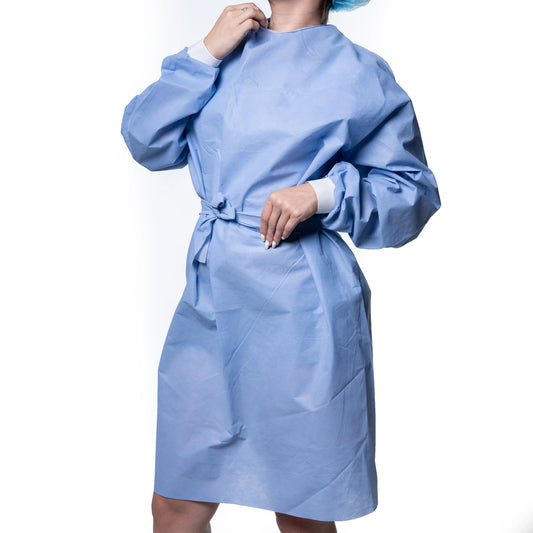 Person wearing a light blue disposable hospital gown with white cuffs, medical supply product.
