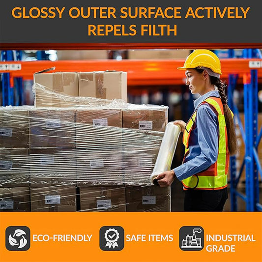 Worker wrapping stacked boxes with industrial stretch film in warehouse, eco-friendly and safe