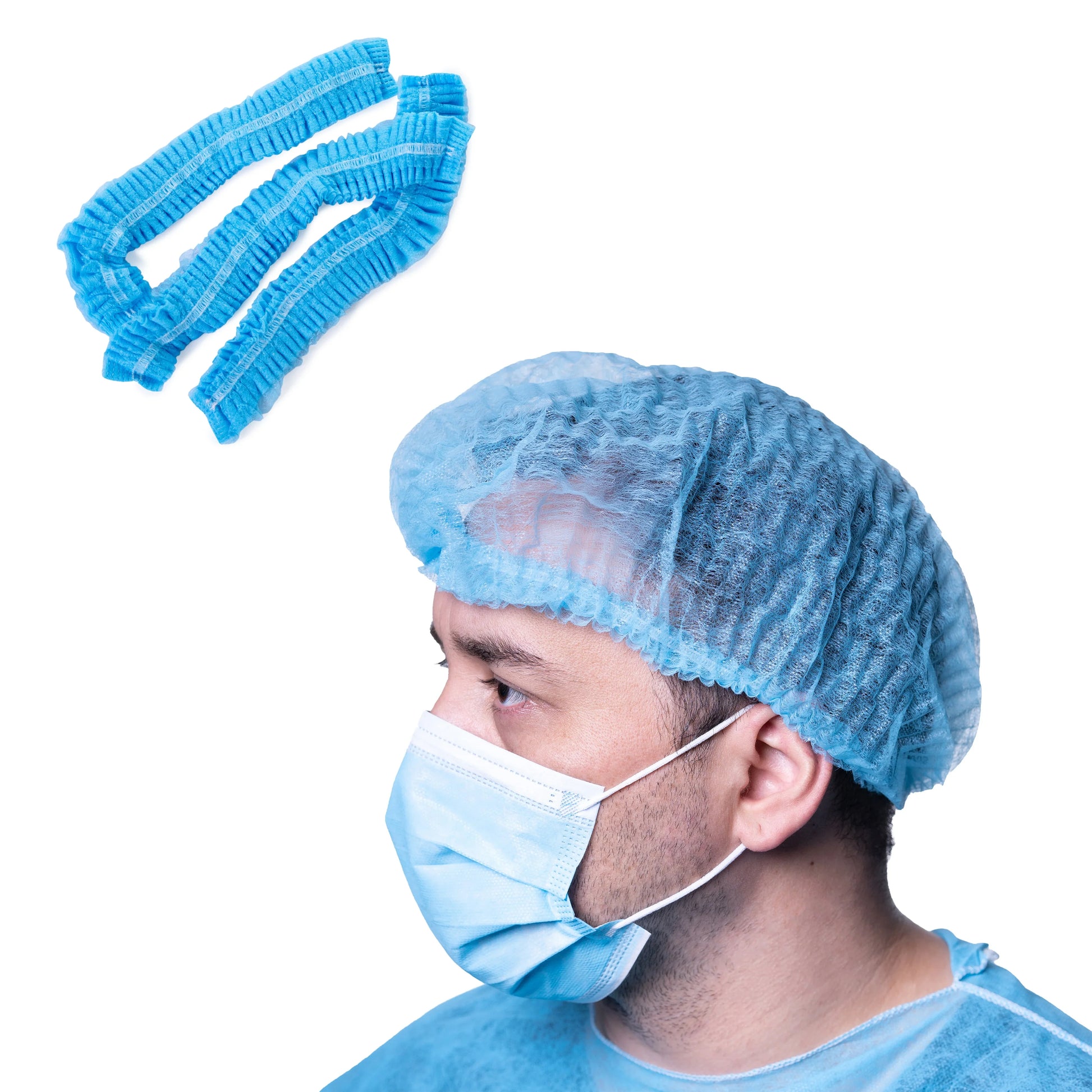 Blue disposable bouffant cap worn by person in medical mask and gown, bulk wholesale supply.