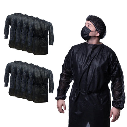 Man wearing black disposable hospital gown, mask, and bouffant cap with bulk gown packs