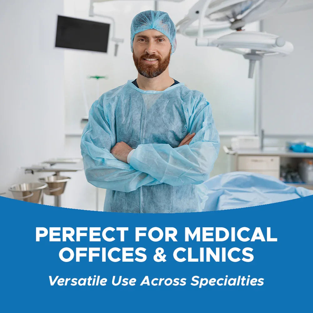Smiling doctor in disposable medical gown and bouffant cap in modern clinic setting